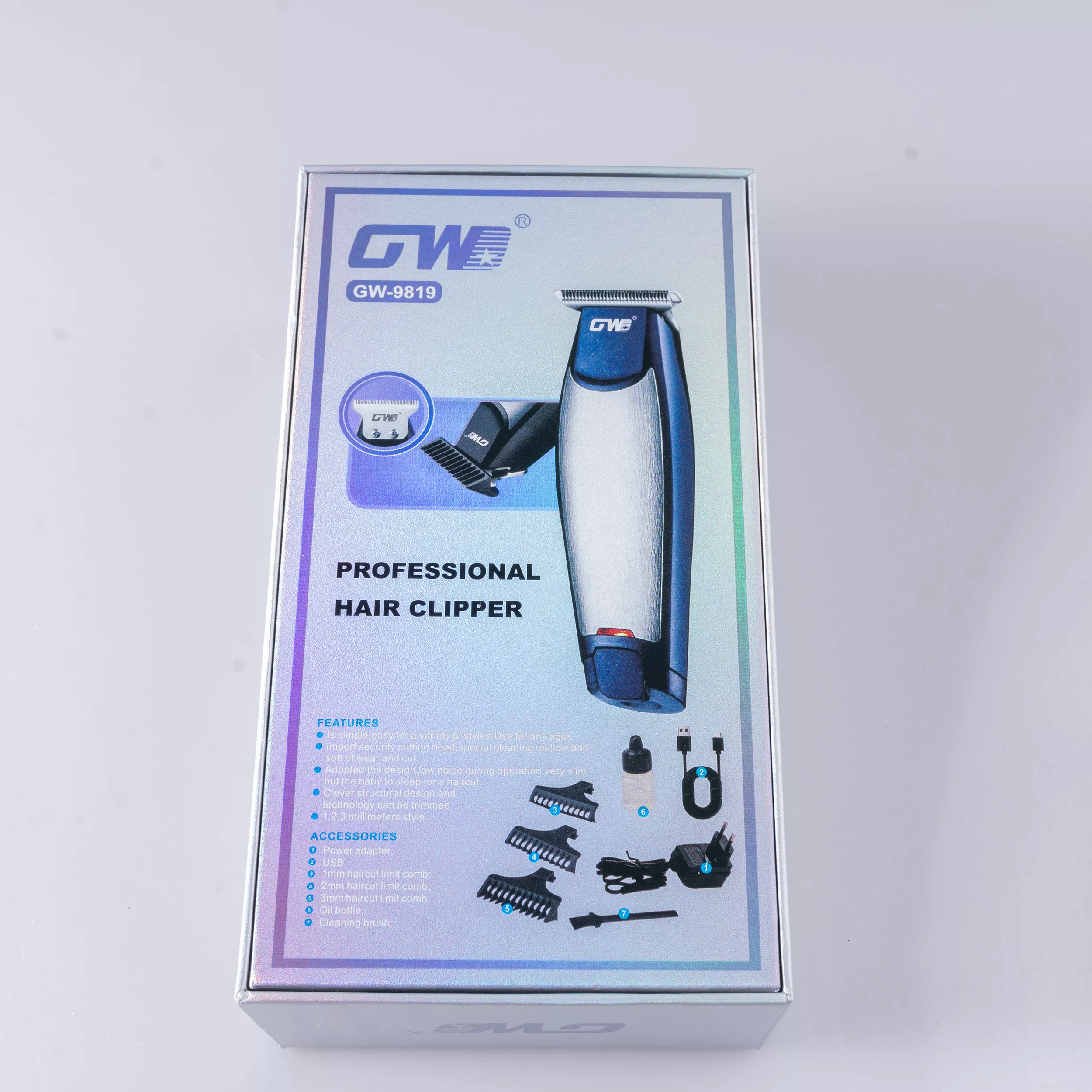 ماشین اصلاح موی سر و صورت شارژی جی دبلیو مدل G-9819، اصلاح به صورت خط زن و صفر زن، منبع انرژی با برق و باتری، تکنولوژی اصلاح به صورت تریمر، اندازه اصلاح 0.1 میلیمتر، مدت زمان شارژ 480 دقیقه و مدت زمان استفاده پس از شارژ 60 دقیقه، به همراه شارژر و روغن