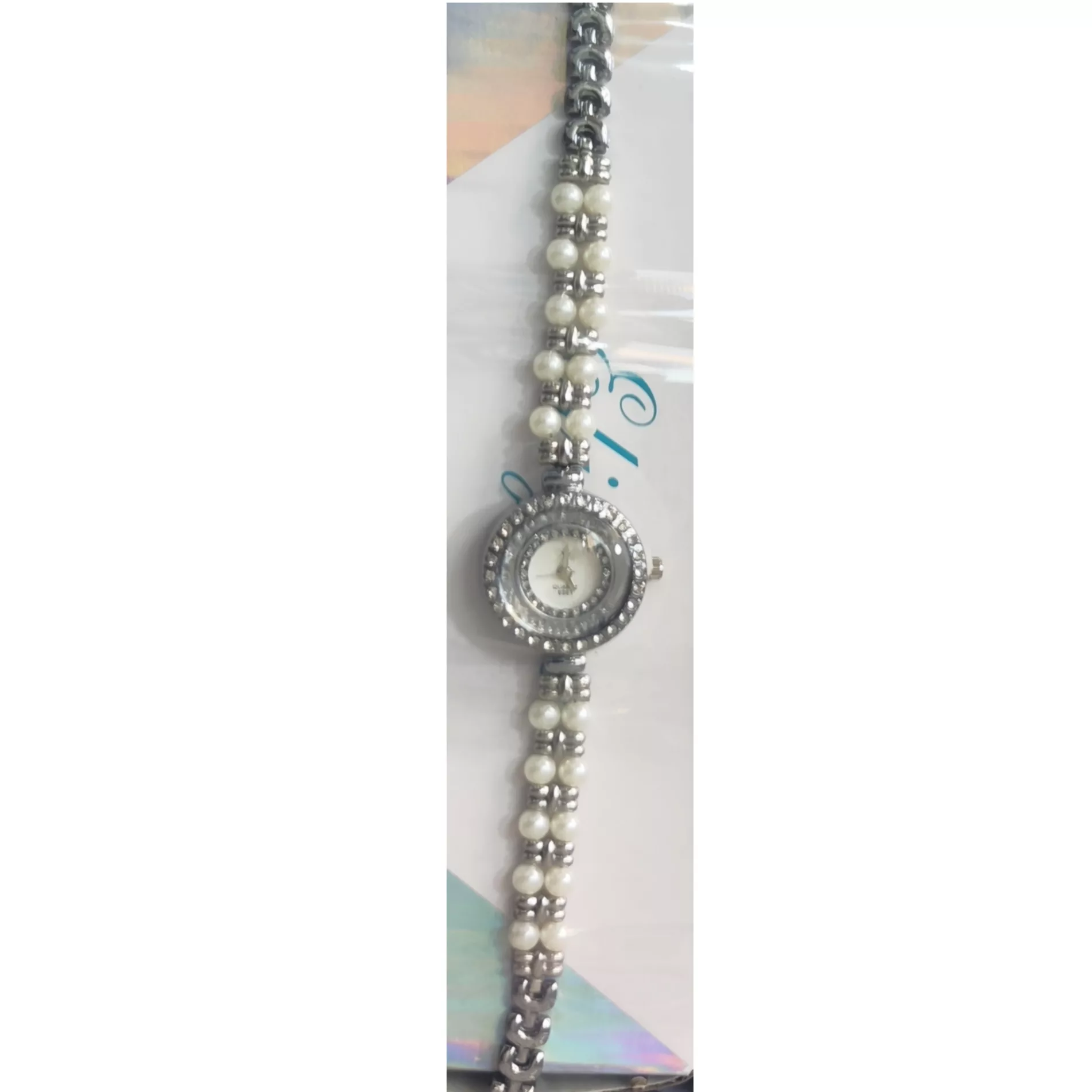 ساعت مچی عقربه‌ای کوارتز زنانه مدل لوکس بند دستبندی مرواریدی قاب دور شنی نگین دار کد ۱.۹