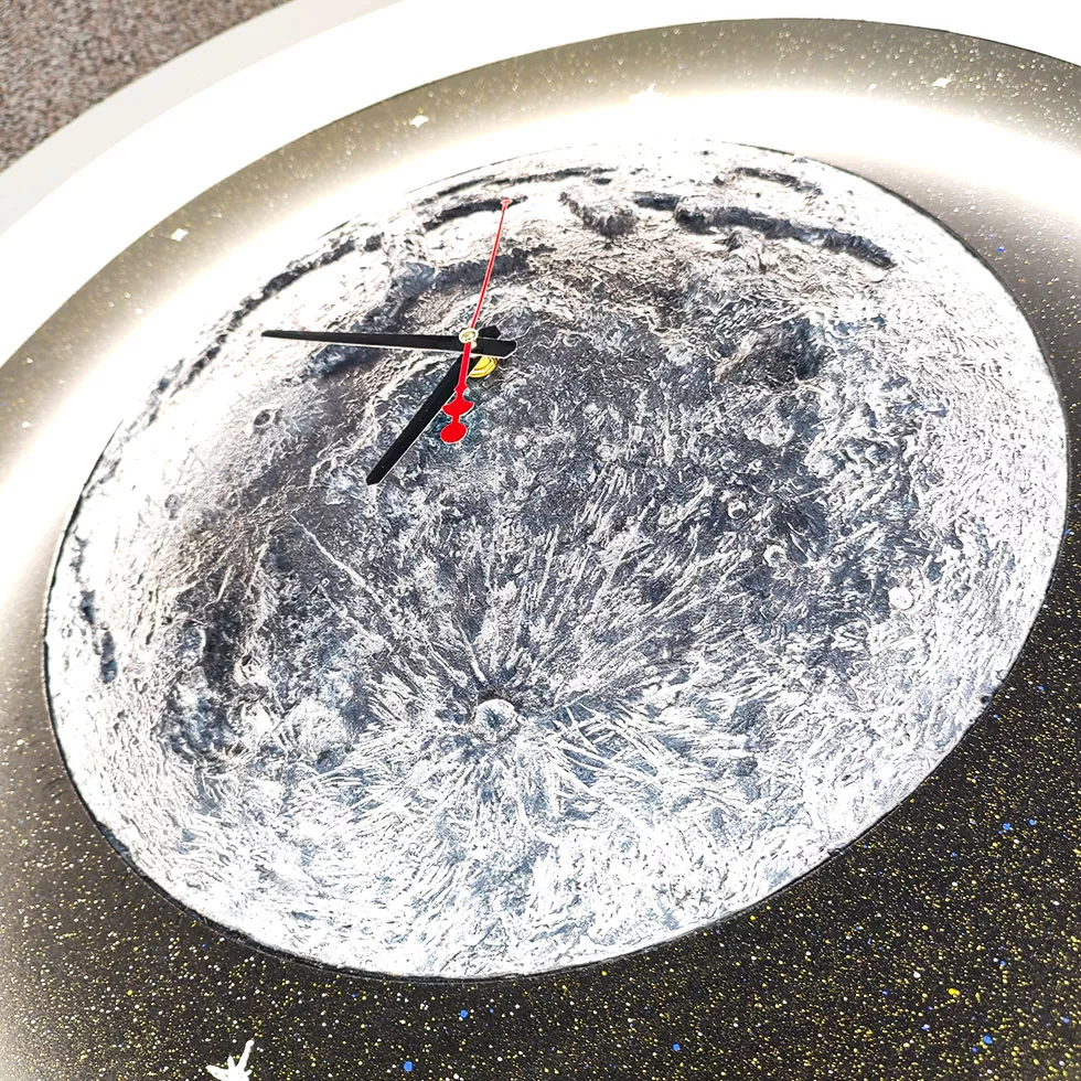 ساعت دیواری مدل کهکشان ماه و ستاره طرح ال ای دی دار کد 70c