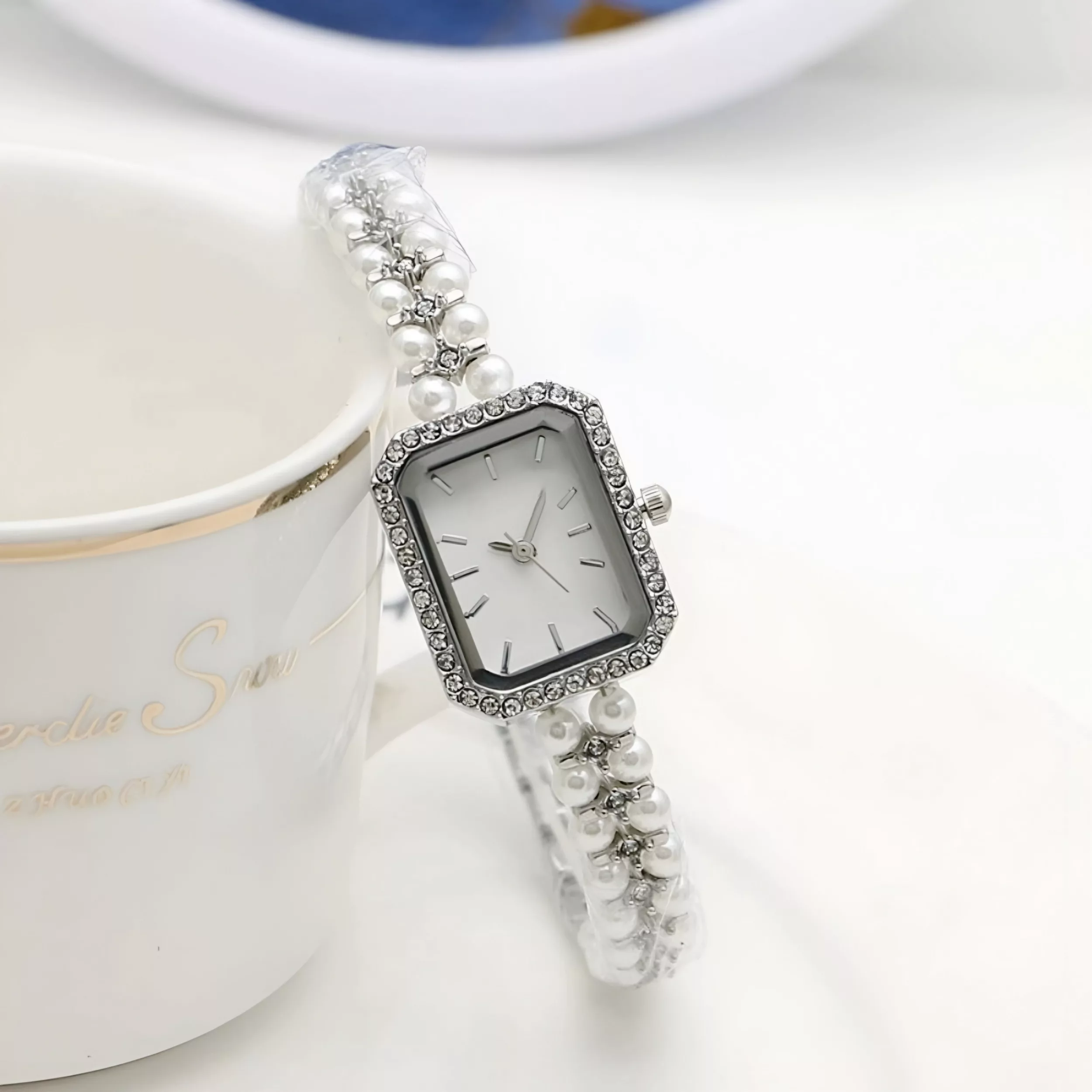 ساعت مچی عقربه‌ای کوارتز زنانه مدل لوکس بند مرواریدی دستبندی کد ۲