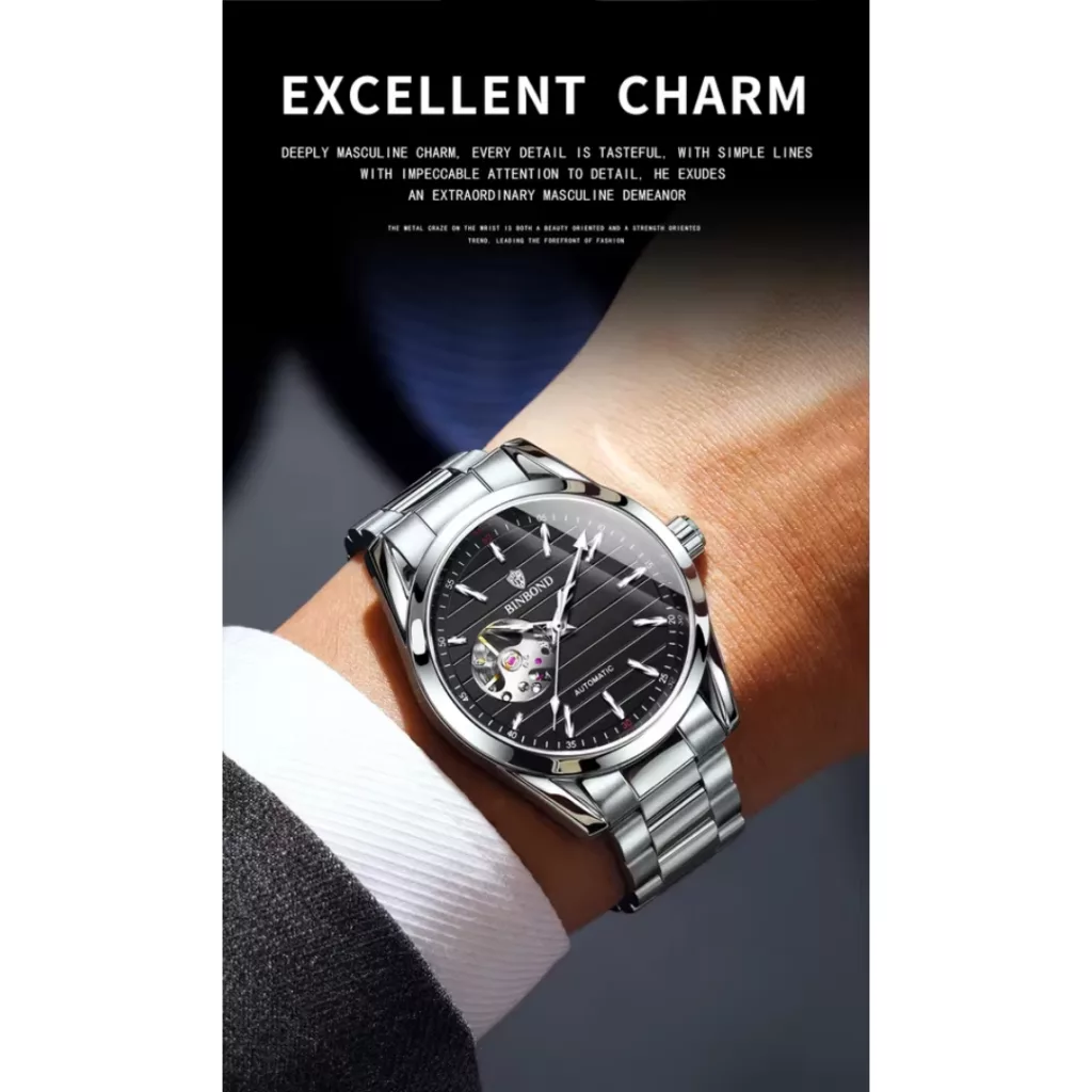 ساعت مچی عقربه‌ای اتوماتیک مردانه بین باند مدل صفحه نیمه اسکلتون بند استیل کد ۲